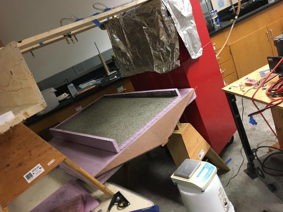 <span class="caption">We used tiny nozzles to spray water onto a sand-coated foam board to test flood generation theory.</span> <span class="attribution"><span class="source">Dana A Lapides</span></span>