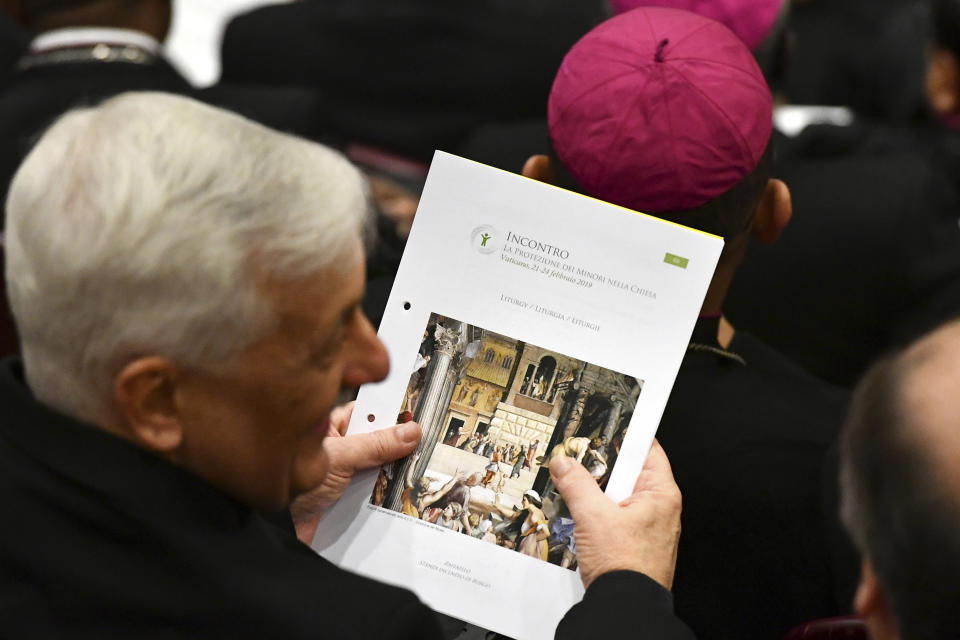 A prelate holds the liturgy booklet at the opening of a sex abuse prevention summit, at the Vatican, Thursday, Feb. 21, 2019. The gathering of church leaders from around the globe is taking place amid intense scrutiny of the Catholic Church's record after new allegations of abuse and cover-up last year sparked a credibility crisis for the hierarchy. (Vincenzo Pinto/Pool Photo via AP)