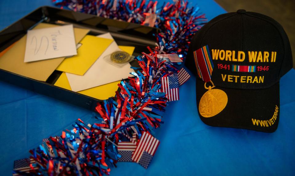 Cards and gifts for U.S. Army veteran Thurman Carnal’s 107th birthday are seen on a table during a celebration the Terrace at Solarbron in Evansville, Ind., Thursday, July 6, 2023.