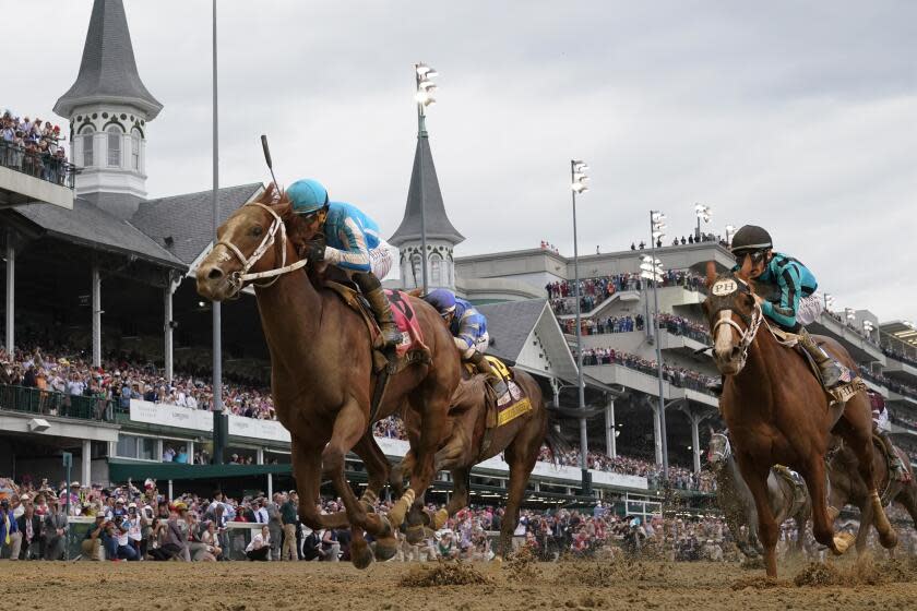 FILE - Mage (8), with Javier Castellano aboard, wins the 149th running of the Kentucky Derby horse.
