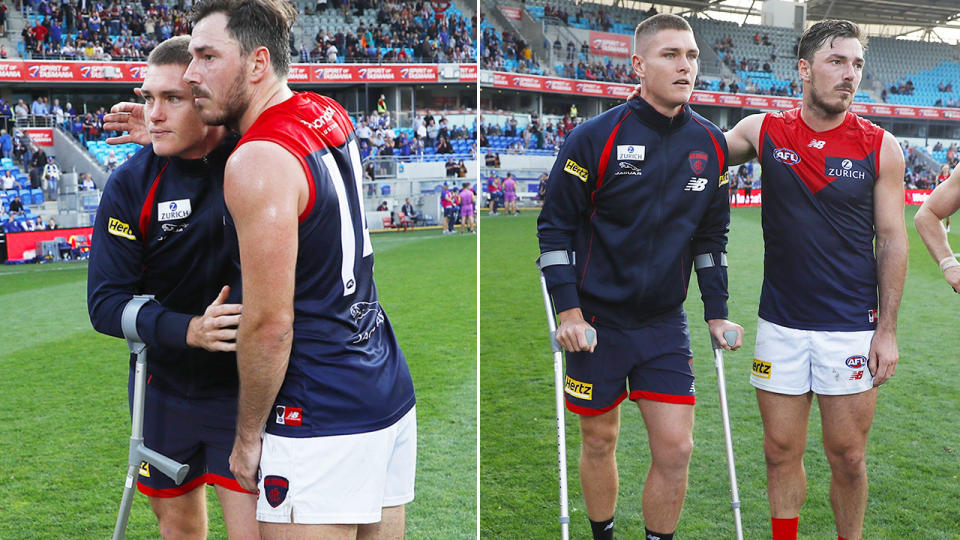 Pictured here, Melbourne's Adam Tomlinson is on crutches after tearing his ACL.