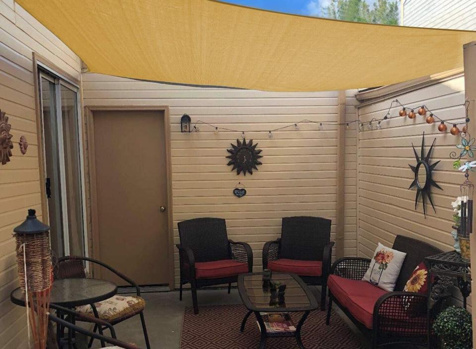 Add cover and comfort to your outdoor sitting area with a convenient sun shade. (Source: Amazon)