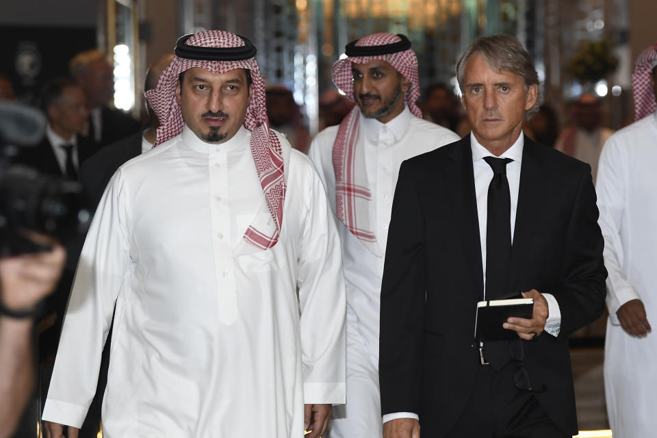 Roberto Mancini and Yasser Al Misehal, the Saudi Arabian Football Federation president, arrive for a press conference in Riyadh, Saudi Arabia, on Monday, Aug. 28, 2023. Mancini was appointed coach of the Saudi Arabia national team on Sunday, just two weeks after the European Championship-winning manager surprisingly left his job in charge of Italy. (AP Photo)