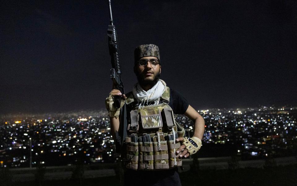 Al Ausy ,18, poses as he guards the area on Wazir hill overlooking Kabul on September 19, 2021 in Kabul, Afghanistan - Paula Bronstein/Paula Bronstein