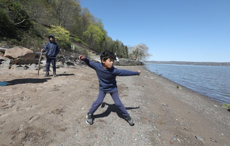 Noa Almiron-Johnson of Valley Cottage skips rocks into the Hudson River at Nyack Beach State Park in Upper Nyack April 22, 2024.