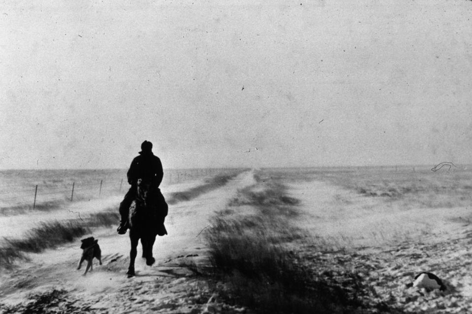 November 1940: A farmer riding out in Lymon County, South Dakota, during the first stages of a blizzard.