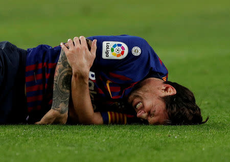 Soccer Football - La Liga Santander - FC Barcelona v Sevilla - Camp Nou, Barcelona, Spain - October 20, 2018 Barcelona's Lionel Messi after sustaining an injury REUTERS/Albert Gea