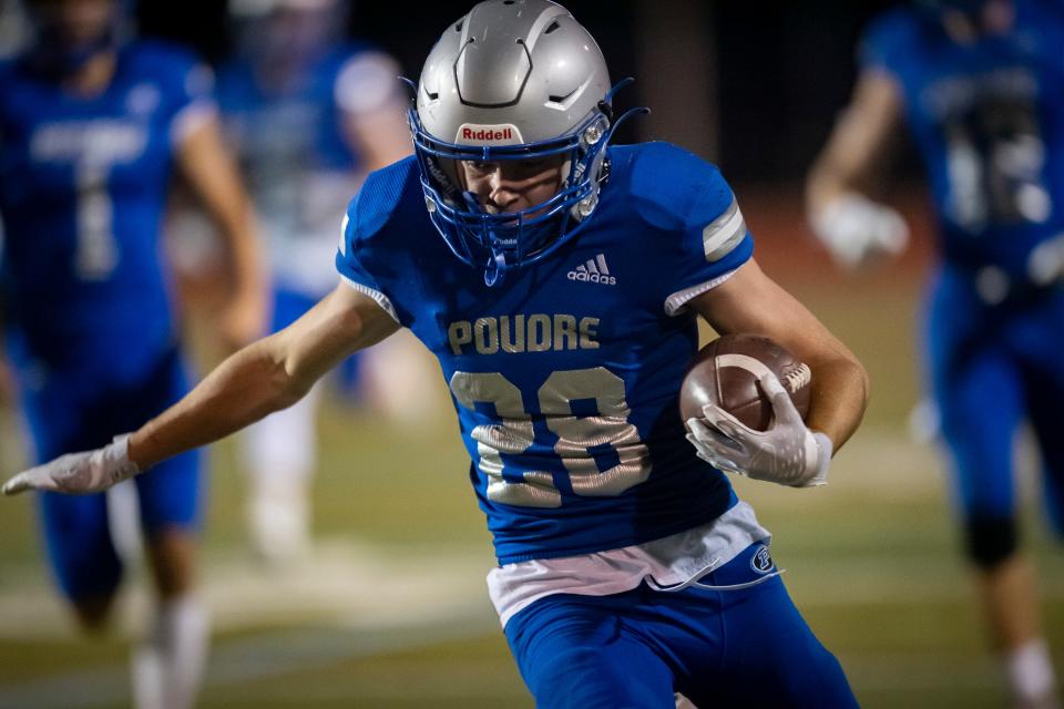 Poudre High School's Luke Olson runs an interception back 45 yards for a touchdown during the Impalas' 40-0 win over Monarch on Friday, Sept, 23, 2022, at French Field in Fort Collins.