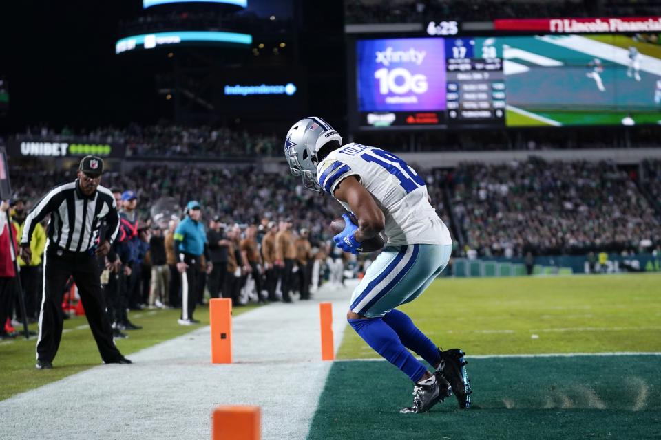 Dallas Cowboys wide receiver Jalen Tolbert (18) scores a touchdown during the second half of an NFL football game against the Philadelphia Eagles on Sunday, Nov. 5, 2023, in Philadelphia. (AP Photo/Matt Slocum)