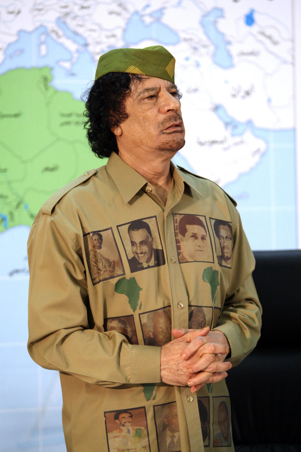 Wearing his loyalties on his chest. A quirky individualistic take on the traditional band t-shirt.     Gaddafi during a press conference in Tripoli, Libya. Gaddafi was urging African leaders to unite in a single government to stop foreign powers taking control of the continent.