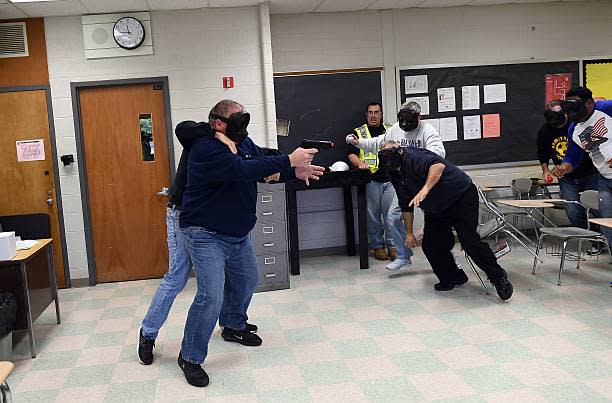 An “active shooter” is tackled as he attacks a classroom during ALICE (Alert, Lockdown, Inform, Counter and Evacuate) training at the Harry S. Truman High School in Levittown, Pennsylvania, on Nov. 3, 2015. (Jewel Samad / Getty Images)