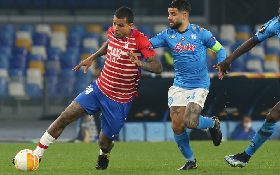 Granada's Brazilian midfielder Robert Kenedy Nunes do Nascimento "Kenedy" fights for the ball with Napoli's Italian striker Lorenzo Insigne (C) and Napoli's French midfielder Tiemoue Bakayoko (R) during the UEFA Europa League round of 32 second leg football match SSC Napoli vs Granada CF - LightRocket/KONTROLAB 