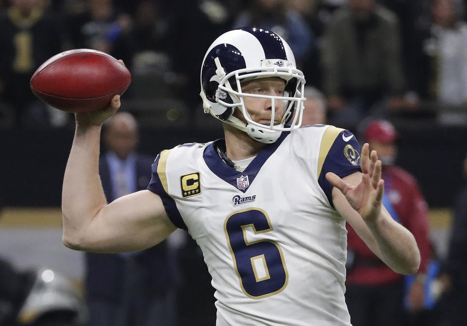 Los Angeles Rams' Johnny Hekker throws for a first down during the first half of the NFL football NFC championship game against the New Orleans Saints, Sunday, Jan. 20, 2019, in New Orleans. (AP Photo/John Bazemore)