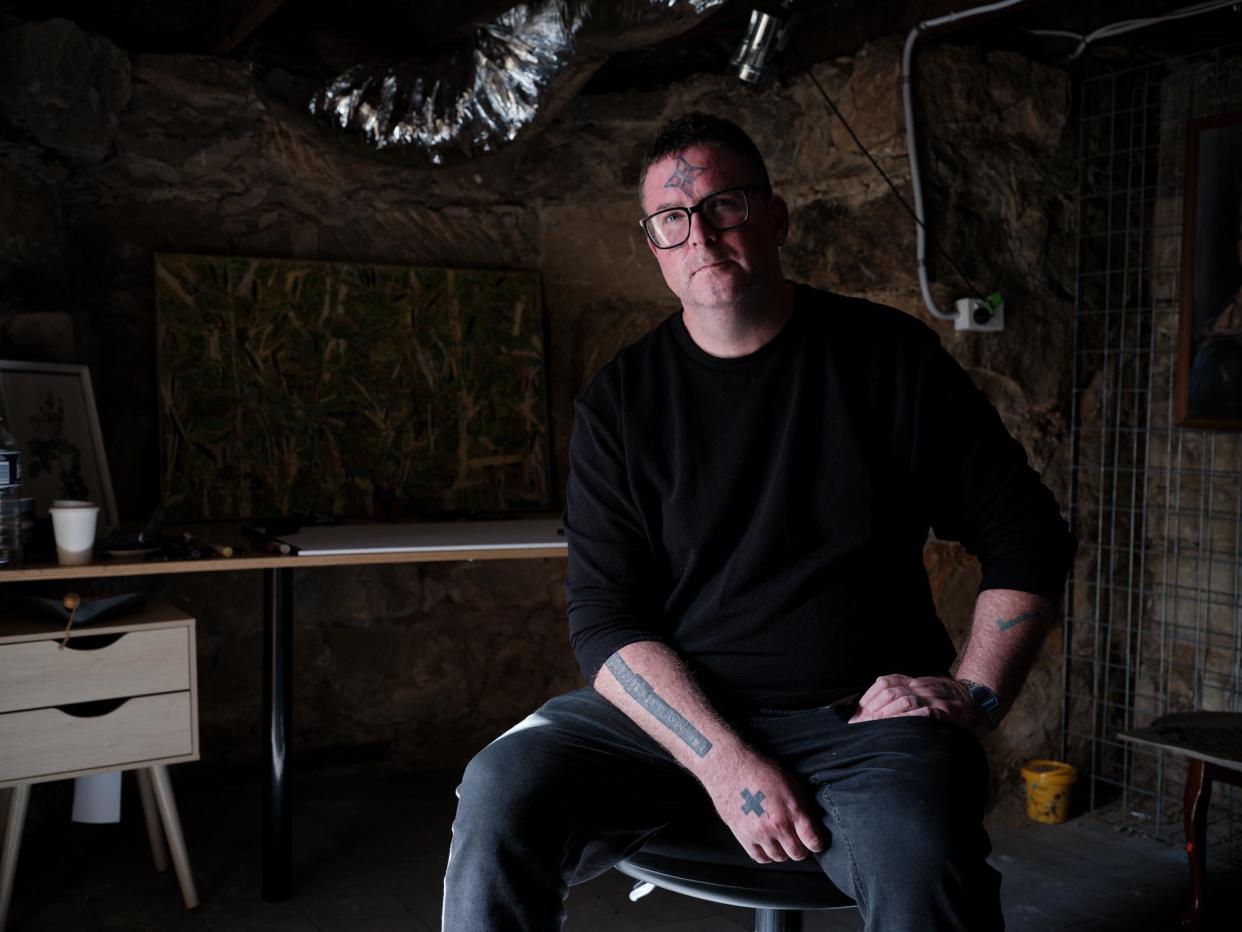 <span>Having lived at three different addresses since moving back to Hobart three months ago, artist Eamon Miller is one of the many victims of Tasmania’s housing crisis.</span><span>Photograph: Peter Whyte/The Guardian</span>