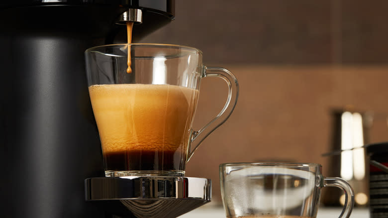 Keurig dispensing coffee into mug