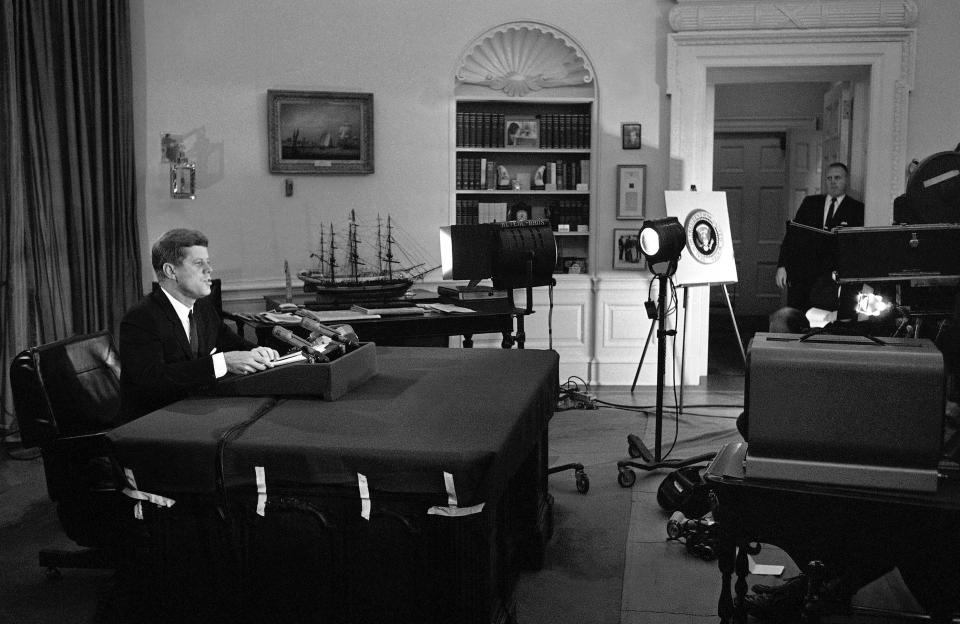 FILE - In this Oct. 22, 1962 file photo, U.S. President John F. Kennedy addresses the nation by television and radio from the Oval Office in Washington, announcing a U.S. naval blockade of Cuba. (AP Photo/WOA)