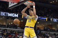 Los Angeles Lakers center Jaxson Hayes dunks against the Memphis Grizzlies during the first half of an NBA basketball game Wednesday, March 27, 2024, in Memphis, Tenn. (AP Photo/Brandon Dill)