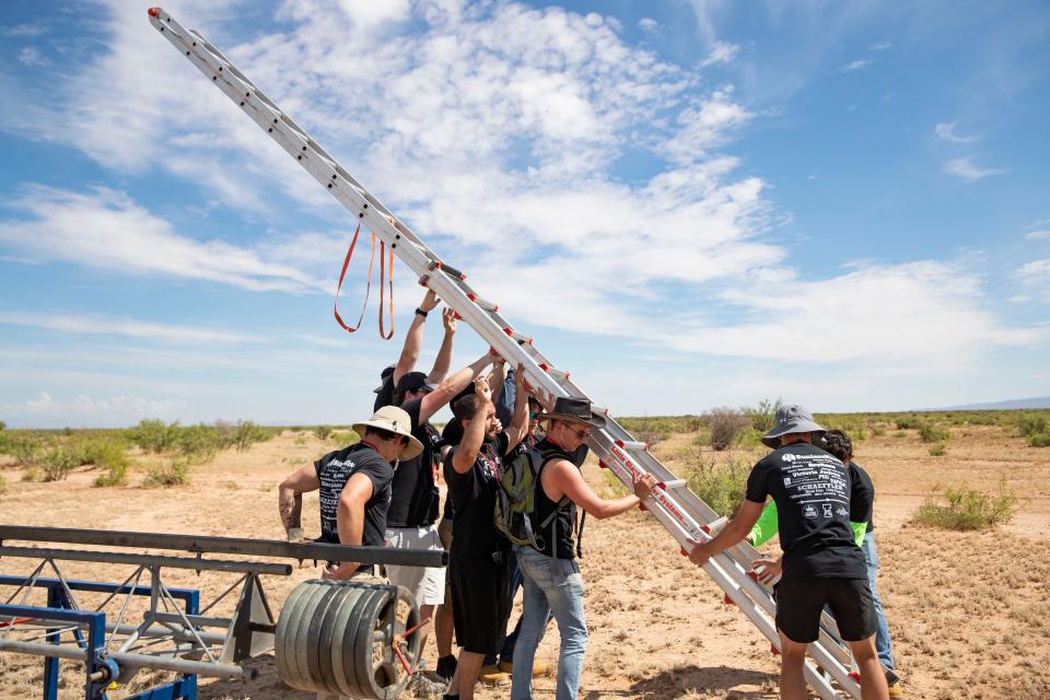 University of Akron's Akronauts Rocket Design Team assemble their rocket on the launch pad during Spaceport America Cup competition at Spaceport America on Thursday, June 23, 2022. The team won a technical award for their project at the event's closing ceremony on June 25.