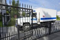 A Russian Federal Bailiffs Service prisoner transport vehicle moves into the courtyard in Yekaterinburg, Russia, Thursday, July 18, 2024, prior to a hearing of Wall Street Journal reporter Evan Gershkovich's suspected spying activities. (AP Photo/Dmitri Lovetsky)