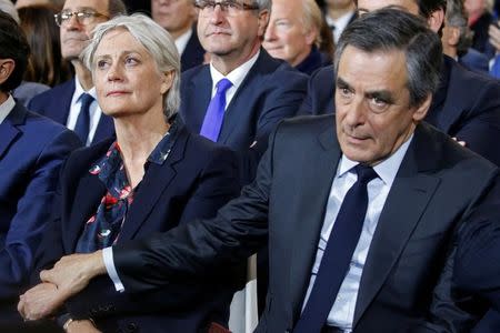 Francois Fillon, member of Les Republicains political party and 2017 presidential candidate of the French centre-right, and his wife Penelope attend a political rally in Paris, France, January 29, 2017. REUTERS/Pascal Rossignol
