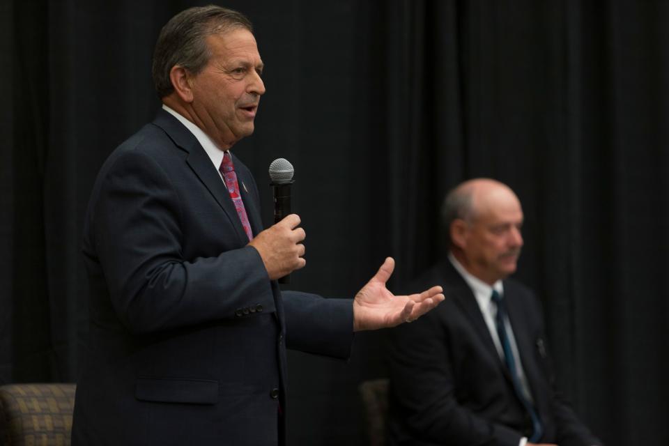 Gil Almquist, an incumbent member of the Washington County Commission, speaks during a debate as his opponent, Allen Davis, looks on. The debates, hosted by the Washington County Republican Party for local candidates ahead of the upcoming primary election, were held at the Dixie Convention Center in St. George on Tuesday, May 17, 2022.