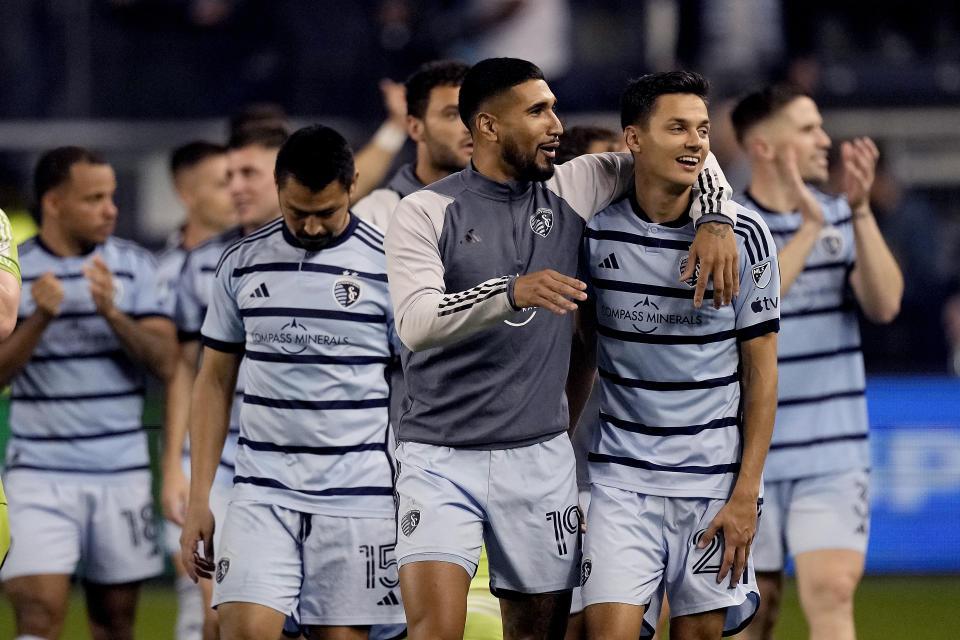 Sporting Kansas City players walk off the field after winning a penalty shootout against San Jose Earthquakes during an MLS soccer wild-card playoff match Wednesday, Oct. 25, 2023, in Kansas City, Kan. (AP Photo/Charlie Riedel)