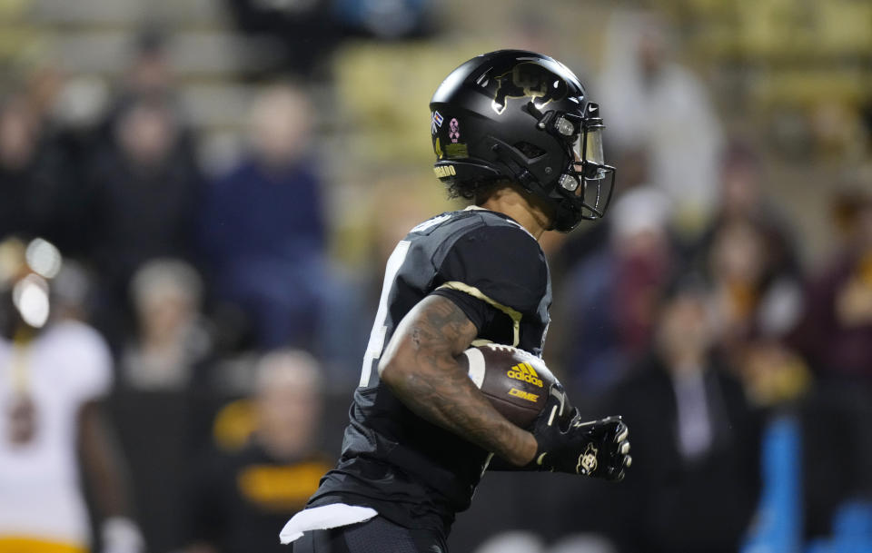 Colorado punt returner Jordyn Tyson fields a punt that he returns for a touchdown against Arizona State in the second half of an NCAA college football game Saturday, Oct. 29, 2022, in Boulder, Colo. (AP Photo/David Zalubowski)