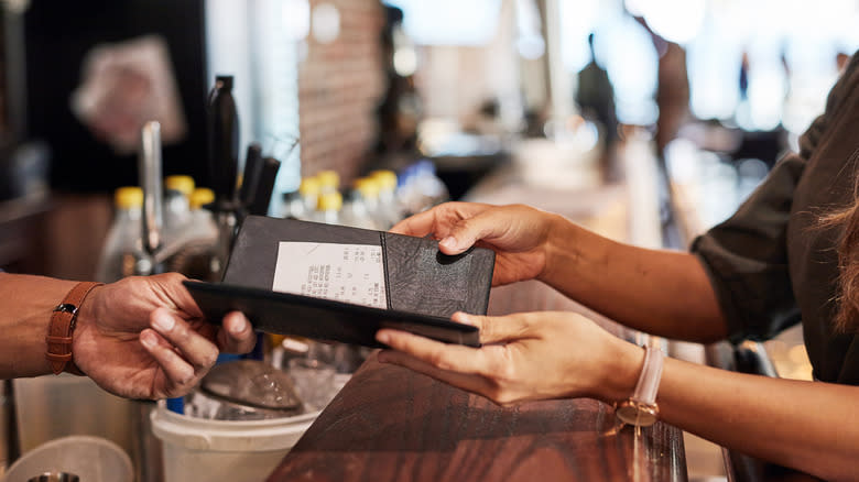 customer paying restaurant bill