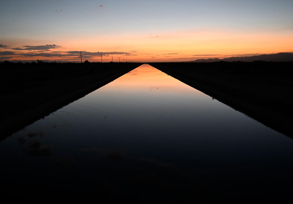 The sun rises over a canal that is full of Colorado River water on Aug. 17, 2022 near Buckeye, Ariz.<span class="copyright">RJ Sangosti—MediaNews Group/The Denver Post/Getty Images</span>