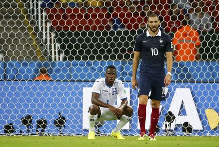 Maynor Figueroa of Honduras looks at France's Karim Benzema (R) after their 2014 World Cup Group E soccer match at the Beira-Rio stadium in Porto Alegre June 15, 2014. REUTERS/Murad Sezer