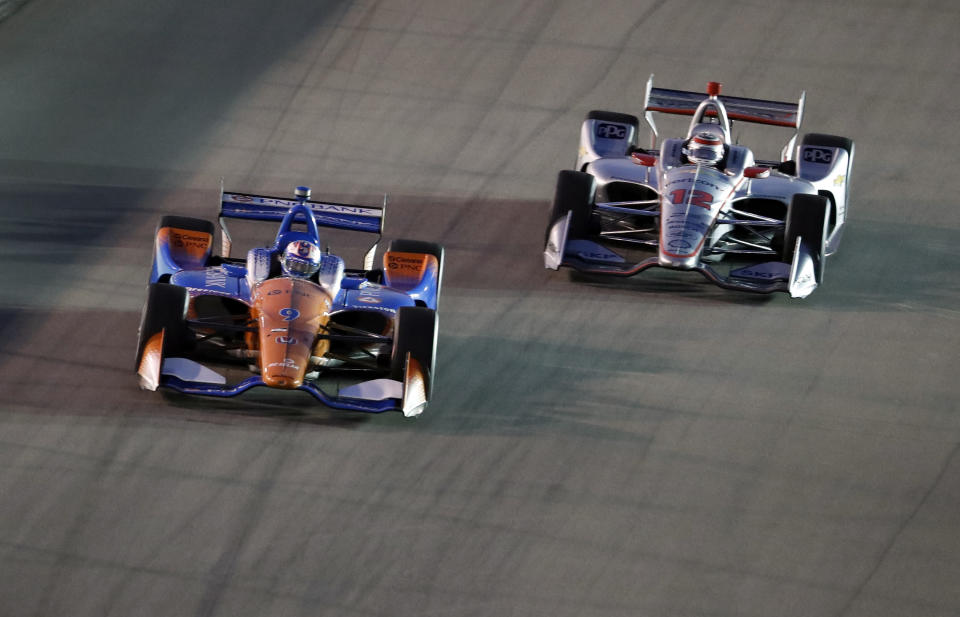 Scott Dixon, left, of New Zealand, leads as Will Power, of Australia, follows during the IndyCar auto race at Gateway Motorsports Park on Saturday, Aug. 25, 2018, in Madison, Ill. (AP Photo/Jeff Roberson)