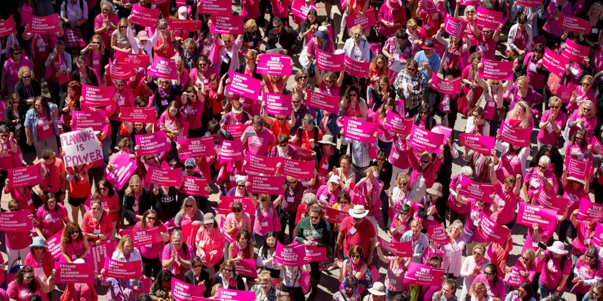 FILE - In this Wednesday, April 5, 2017 file photo, demonstrators participate in a rally for Planned Parenthood at the Capitol in Austin, Texas. Abortion advocates say Texas' capital of Austin has become the first city in the nation to provide funding toward logistical services for abortion access. (Jay Janner/Austin American-Statesman via AP, File)/Austin American-Statesman via AP)