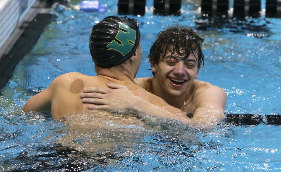 Iowa City West’s Holden Carter, left, congratulates Pleasant Valley’s Owen Chiles after his 100-yard backstroke victory at the IHSAA boys state swim meet Saturday, Feb. 10, 2024 in Iowa City, Iowa.