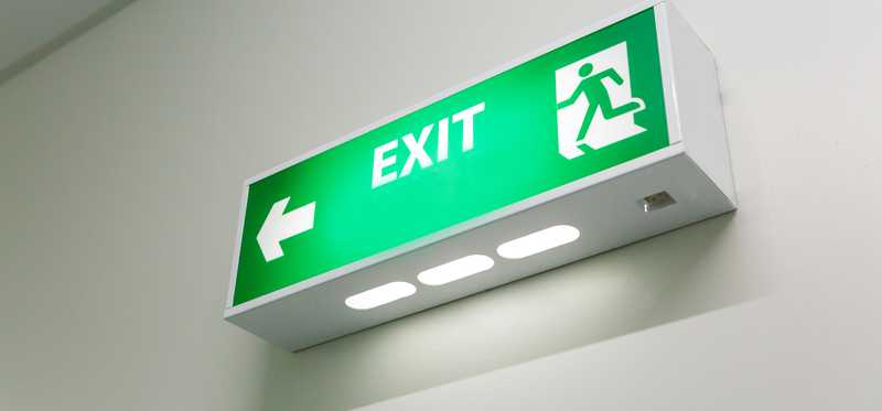 A green exit sign with arrow.