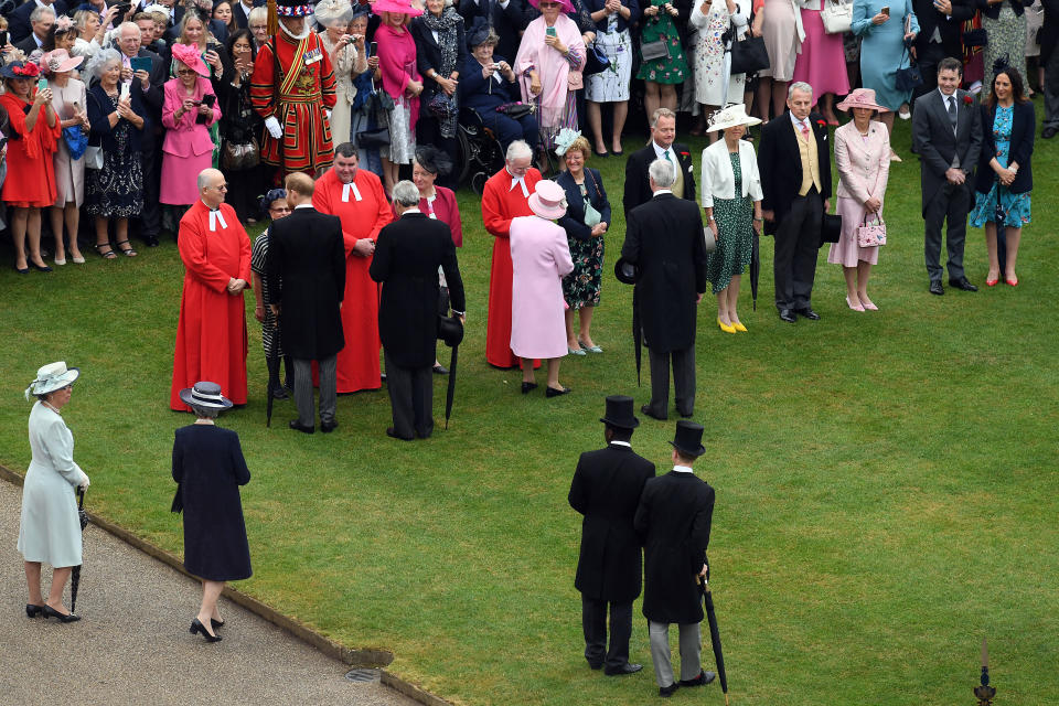 LONDON, ENGLAND - MAY 29: Queen Elizabeth II and Prince Harry, Duke of Sussex greet guests during the Queen's Garden Party at Buckingham Palace on May 29, 2019 in London, England. (Photo by Stuart C. Wilson - WPA Pool/Getty Images)