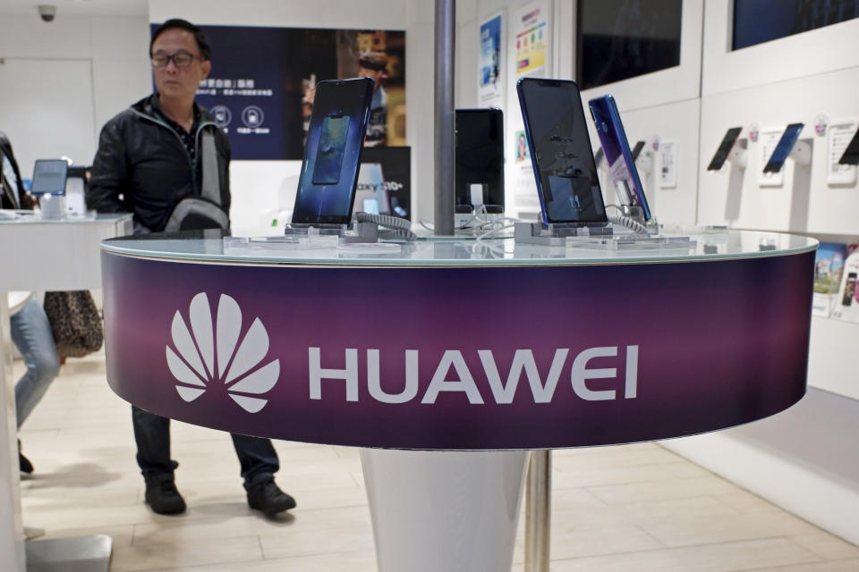 FILE - In this March 29, 2019, file photo, Huawei's mobile phones are displayed at a telecoms service shop in Hong Kong. Chinese tech giant Huawei said Monday, April 22, 2019, its revenue rose 39 percent over a year earlier in the latest quarter despite U.S. pressure on allies to shun its telecom and network technology as a security risk. (AP Photo/Kin Cheung, File)