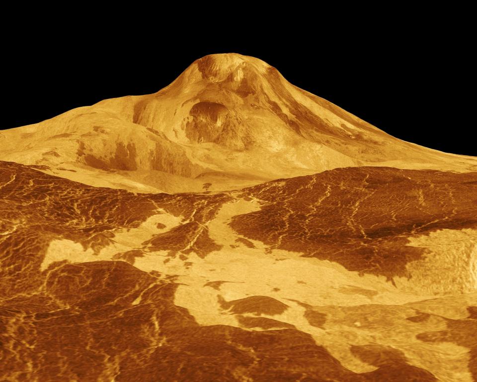 3D rendering of Maat Mons, a volcanic peak on the surface of Venus. Rugged terrain with elevated central peak is visible