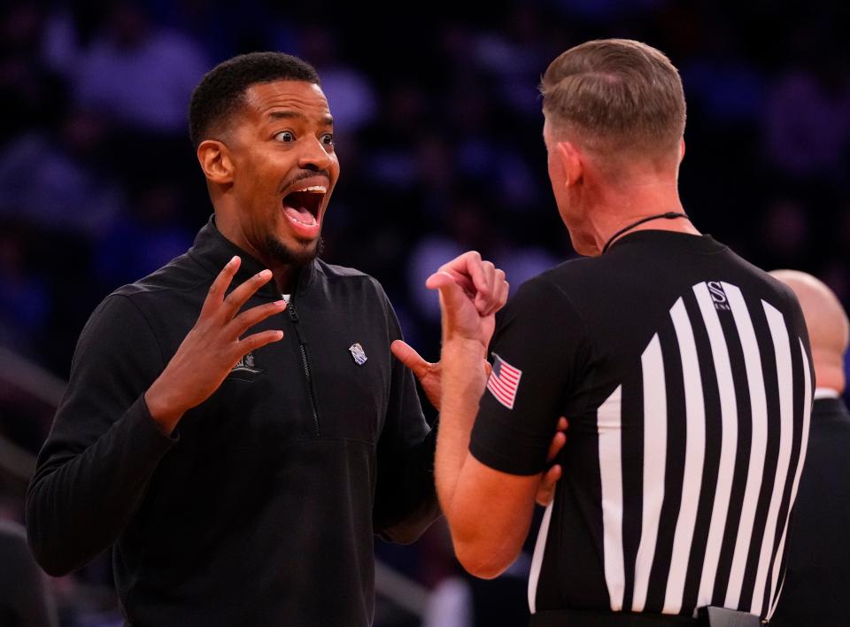 Providence head coach Kim English argues with a referee and is given a technical foul during Thursday night's game against Creighton at Madison Square Garden.