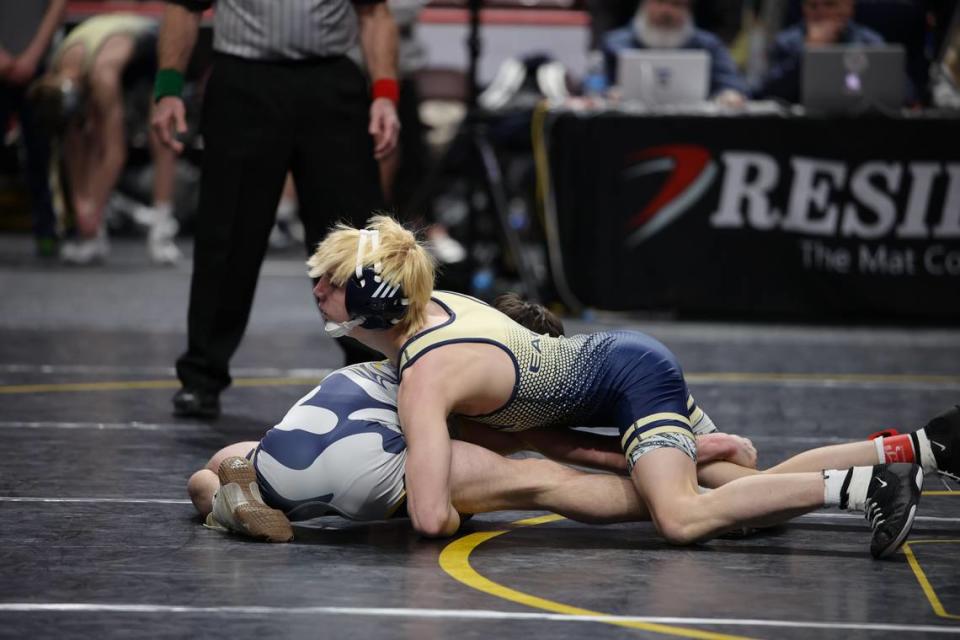 Bald Eagle Area’s Tanner Guenot locks up a cradle on Notre Dame Green Pond’s Jacob Volpe in their 107-pound bout of the Eagles’ 41-16 loss on Thursday in the PIAA Class 2A dual championships first round. Guenot collected a 13-2 major decision.