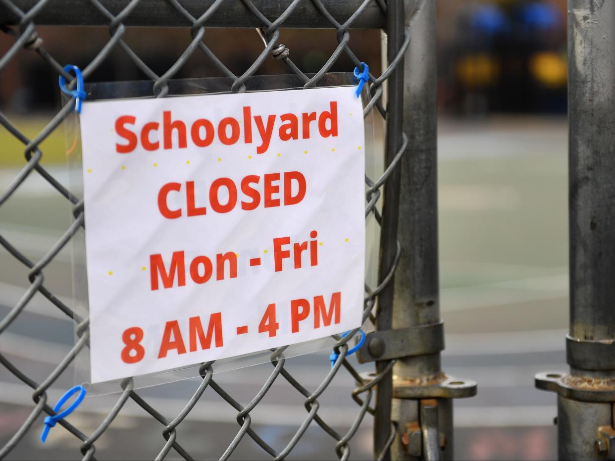 A schoolyard is closed outside a public school in the Brooklyn borough of New York City on 19 November 2020 ((AFP via Getty Images))