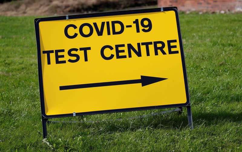 FILE PHOTO: A sign is seen outside a walk-in test facility following the outbreak of the coronavirus disease (COVID-19) in the Farnworth area of Bolton