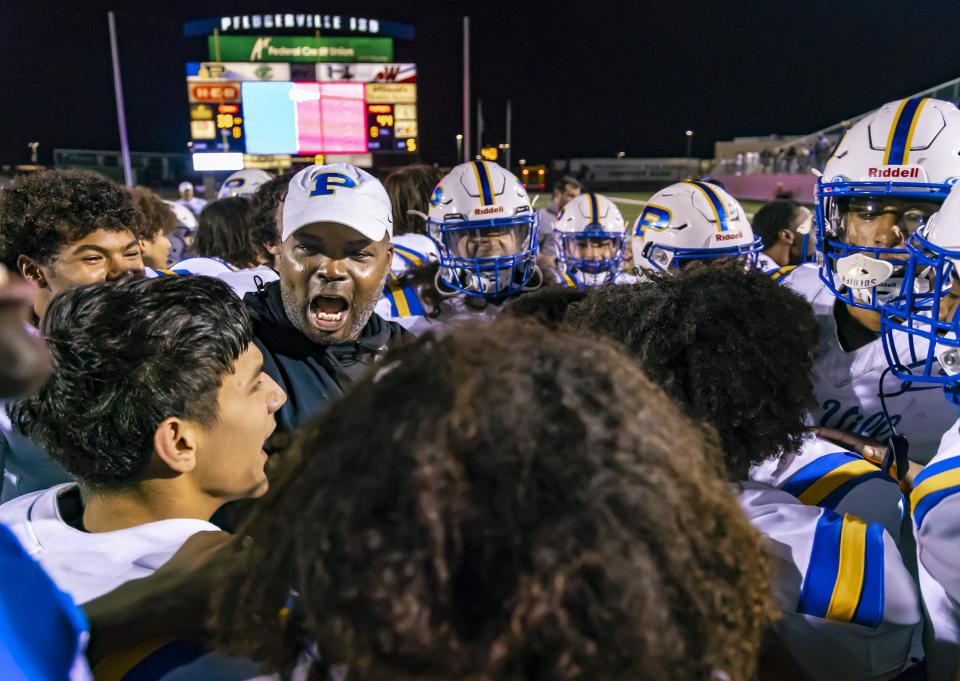 Pflugerville head coach Charles Taylor celebrates Friday night's 44-38 overtime win over Connally, which sent the 3-7 Panthers into the Class 5A playoffs. “These kids have been doubted all year.” Taylor said. “But they came to practice, worked, came to practice and clawed out a win and then got another one.”