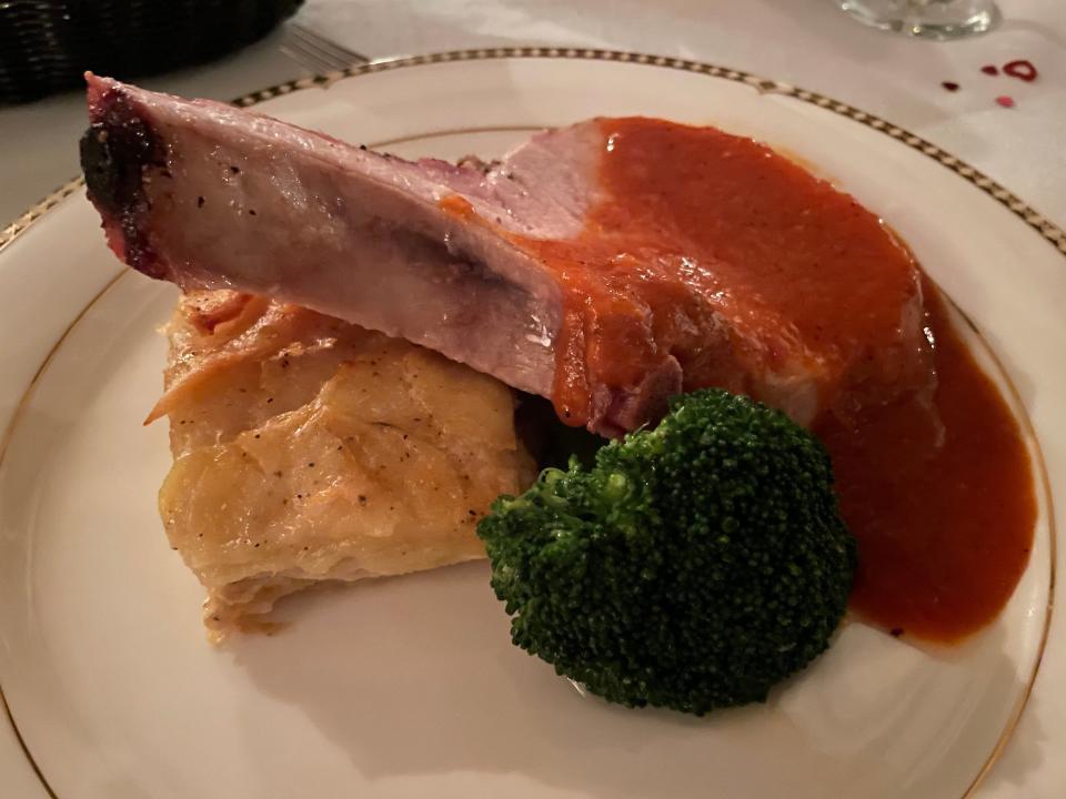 The menu at Buckthorn Inn in Gatlinburg includes roast rack of pork topped with a peach barbecue sauce and accompanied by a duchess-potato casserole and steamed broccoli.