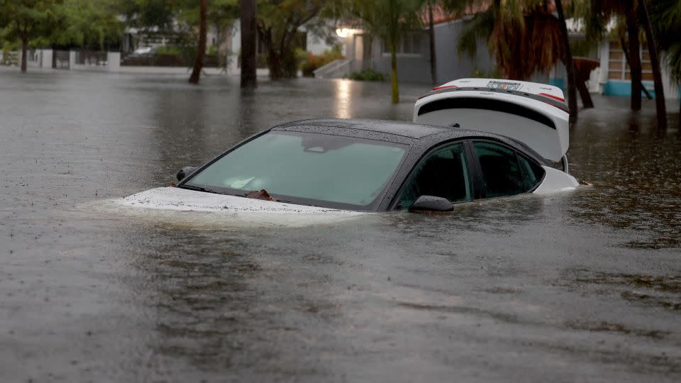 A vehicle sits in floodwaters in Hollywood, Florida on June 12, 2024. - Joe Raedle/Getty Images