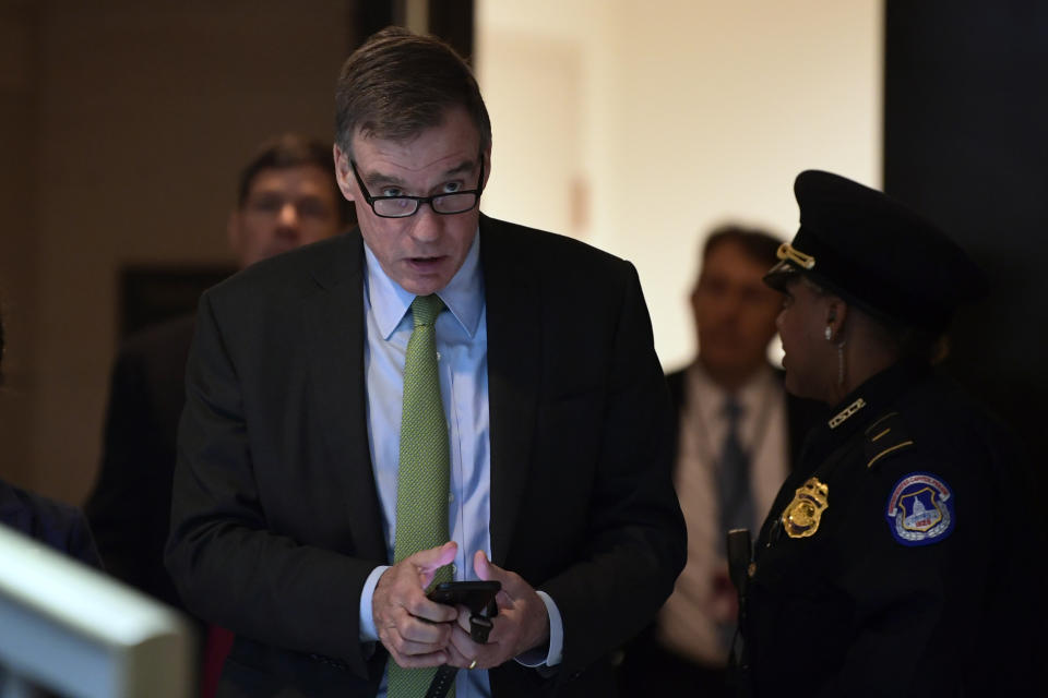 Sen. Mark Warner, D-Va., leaves a closed-door meeting on Capitol Hill in Washington, Tuesday, Dec. 4, 2018, on the slaying of Saudi journalist Jamal Khashoggi. (AP Photo/Susan Walsh)