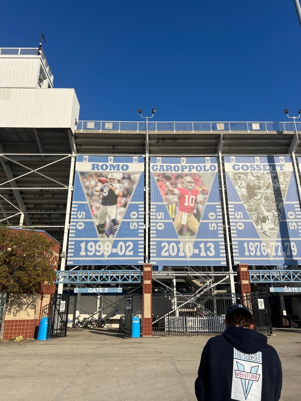 Banners dedicated to Eastern Illinois alumni Jimmy Garoppolo and Tony Romo hang outside of O'Brien Field, home of the EIU Panthers, in Charleston, Ill.