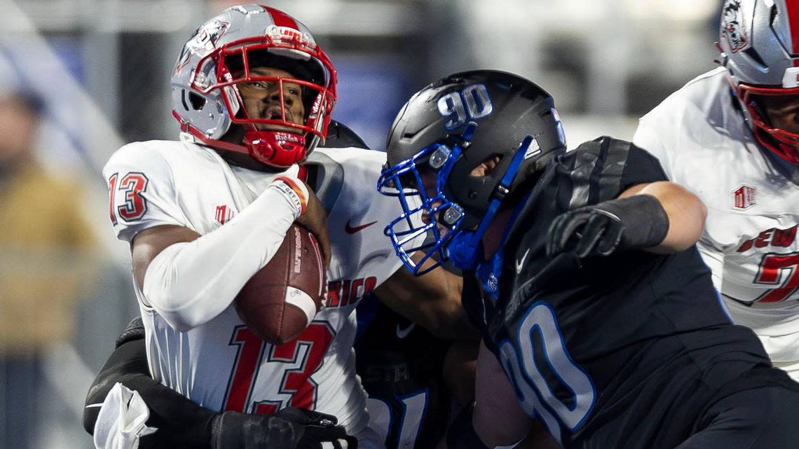 Boise State defensive tackle Braxton Fely and defensive end Ahmed Hassanein collapse to sack New Mexico quarterback Devon Dampler in the second half, Saturday, Nov. 11, 2023, at Albertsons Stadium in Boise. Darin Oswald/doswald@idahostatesman.com