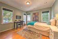 <p>Here’s one of the four bedrooms, this one features French doors and wood floors. <br> (Realtor.com) </p>