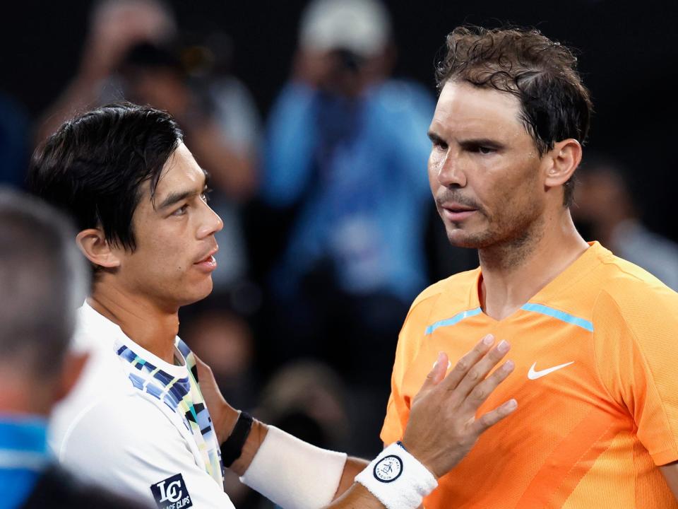 Rafael Nadal (right) shakes hands with Mackie McDonald following his straight-set loss at the Australian Open.