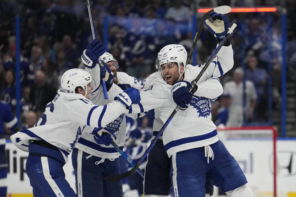 Toronto Maple Leafs center John Tavares (91) celebrates his game-winning goal against the Tampa Bay Lightning during overtime in Game 6 of an NHL hockey Stanley Cup first-round playoff series Saturday, April 29, 2023, in Tampa, Fla. (AP Photo/Chris O'Meara)